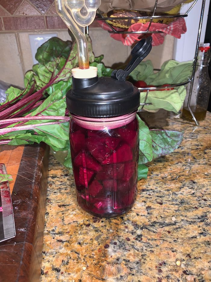 Chopped beets in quart jar, covered in brine