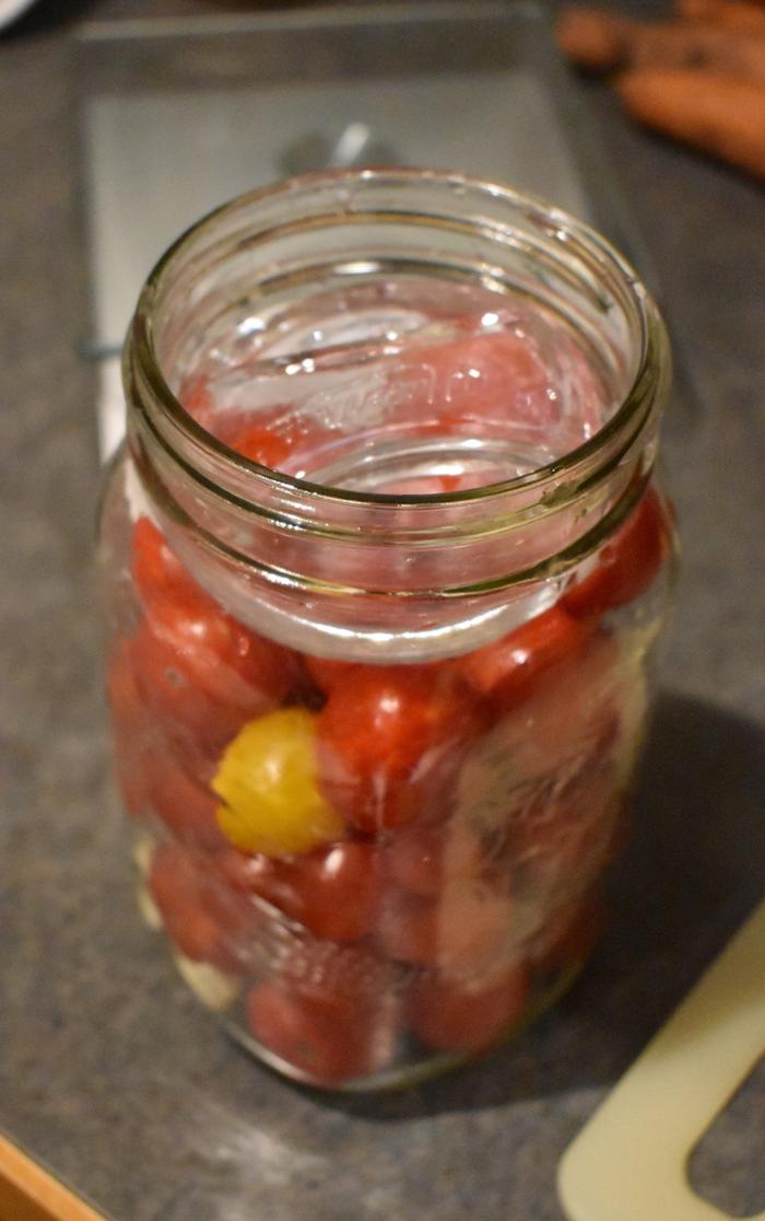 Tomatoes in the jar with the Pickle Pebble