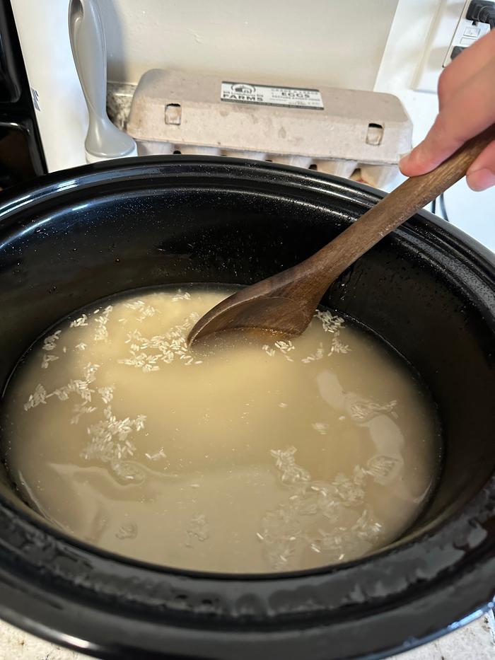 mixing rice, water, and salt