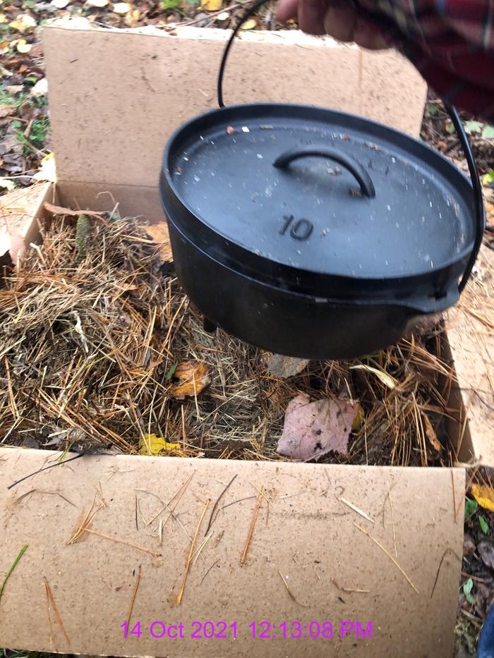 I mixed in a bunch of pine needles for topping the Dutch oven in the box. 