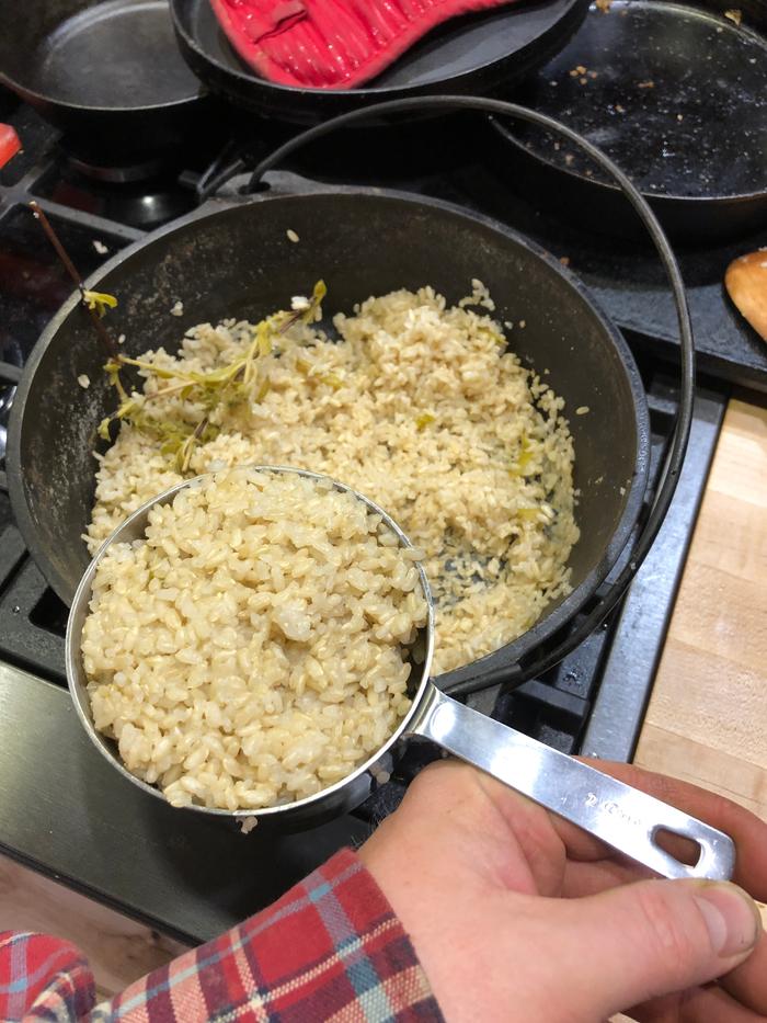 The same two cup scoop in the top picture with all the extra rice in the background. 