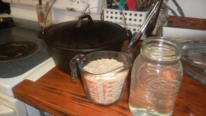 Two cups of rice and a quart of water. My Dutch oven is all ready to go.