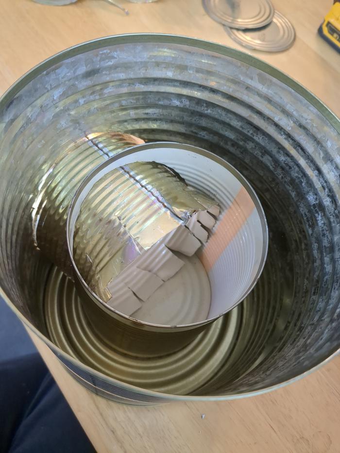 Getting the can to fit in the smaller can on the inside as well as the big can was even harder.