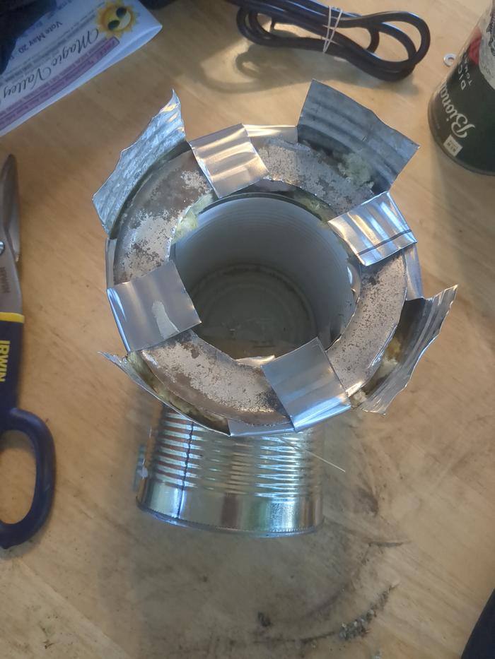Getting the insulation in and folding the tabs down.