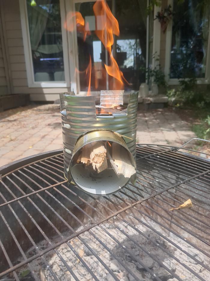 The completed stove. Started a fire in the middle then started feeding sticks/woodchips through the tube.