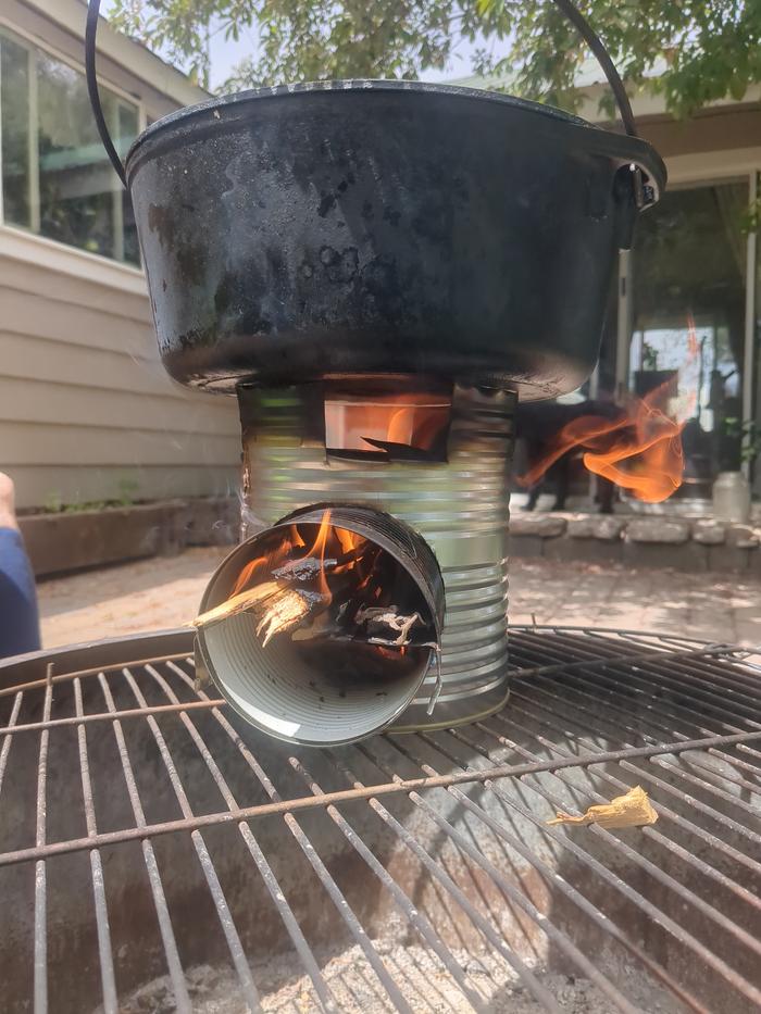 I kind of wasn't expecting the can to hold the weight of the dutch oven but it fit perfectly and the fire was nicely shooting up to heat it up.