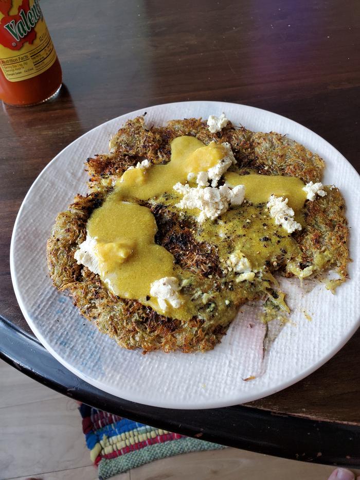 hash browns with vegan egg yolk and vegan queso fresco