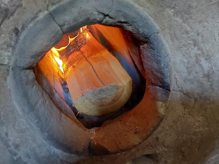 Into the fire! I could fit more in, but I really want longer burns at a lower temp right now 