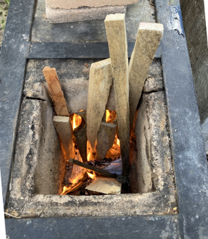 fire started - check out the beginnings of coals off that kindling