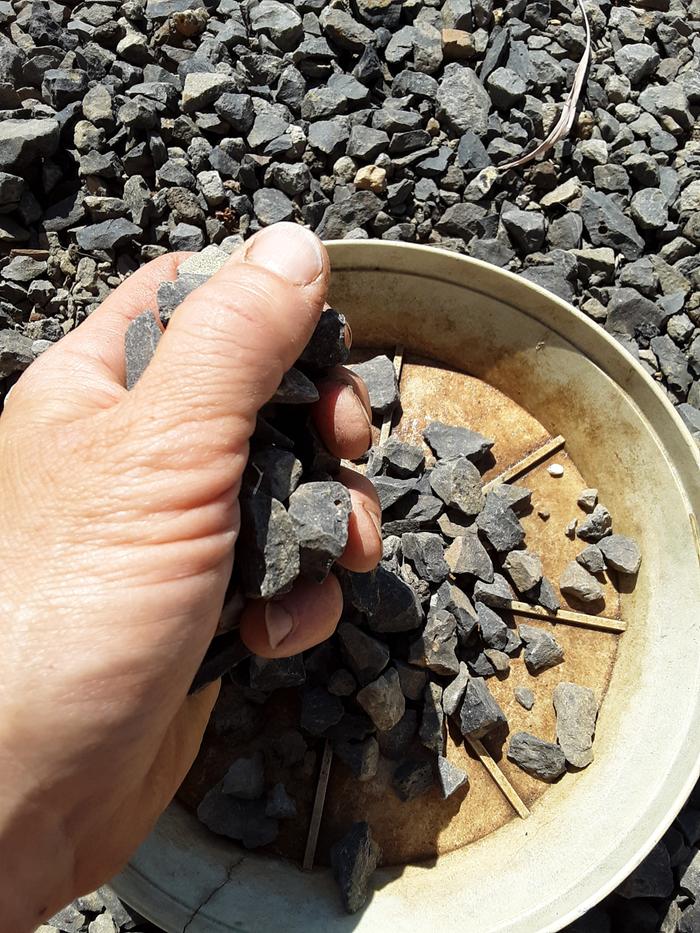 Filling saucer with rocks