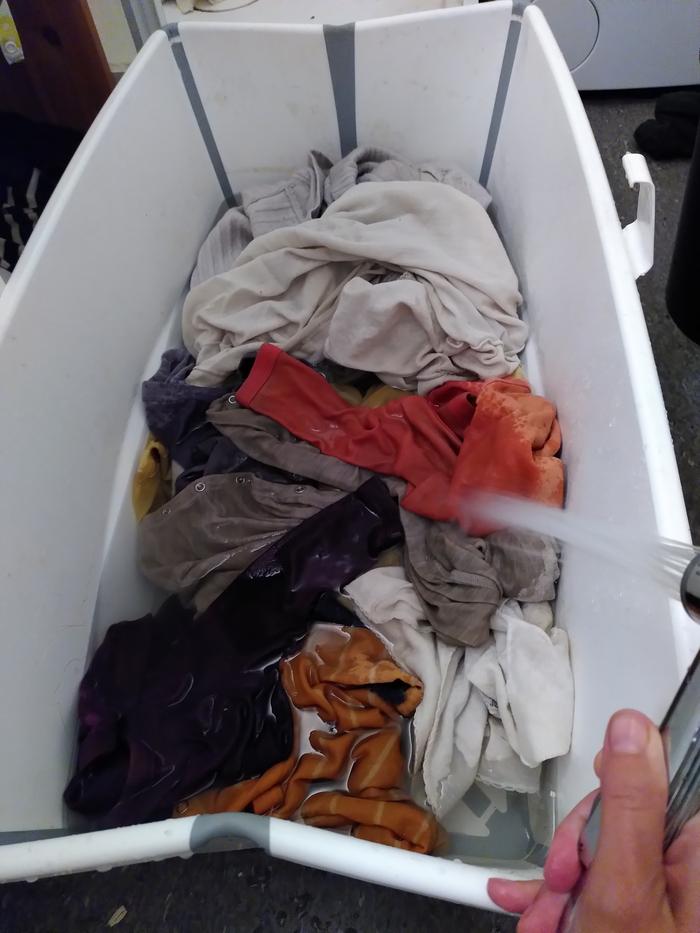 All the clothes in baby bath tub