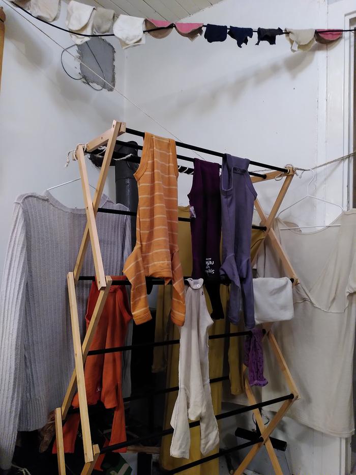 Drying the clothes next to the oven