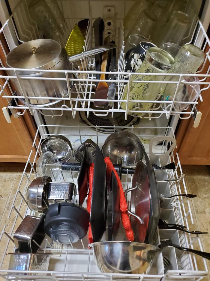 dishwasher full of dirty dishes.