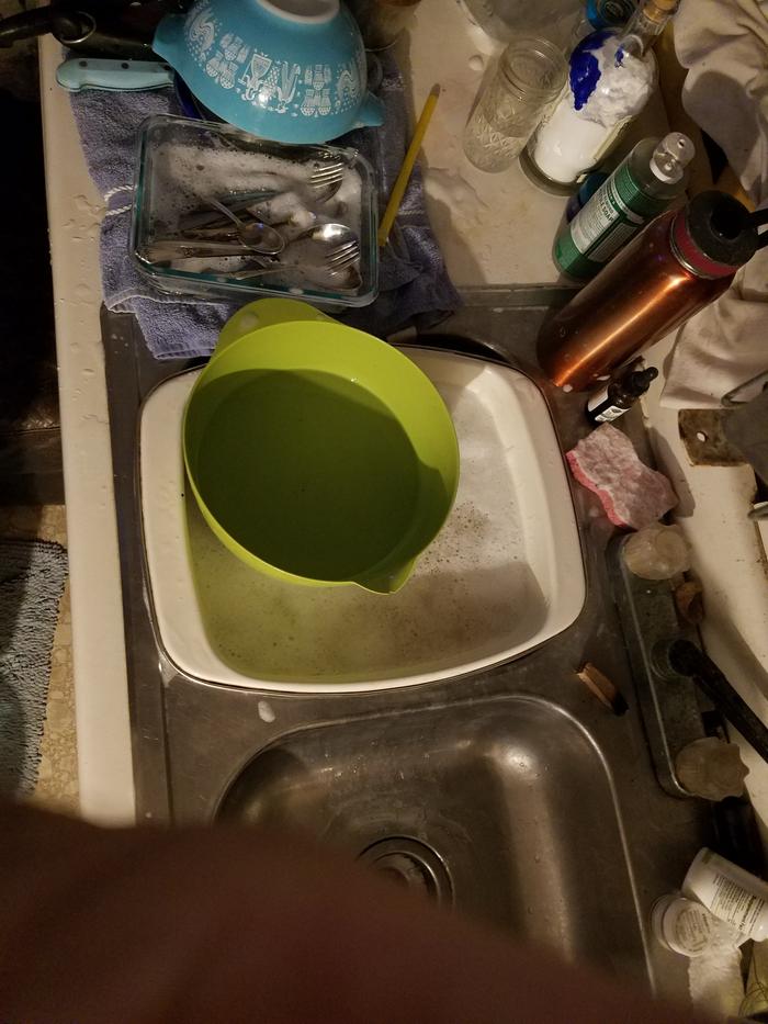 Using a bowl to pour rinse water