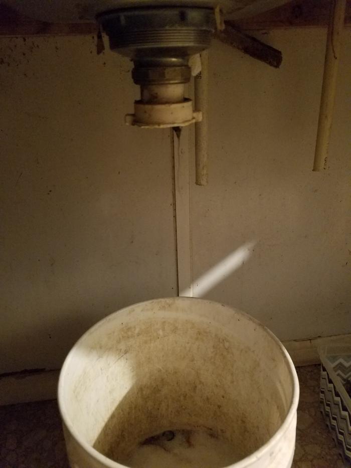 Under my sink, drains to bucket for watering garden
