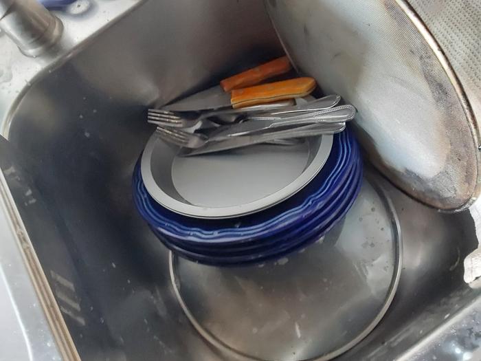 Dishes scrubbed and waiting to be rinsed