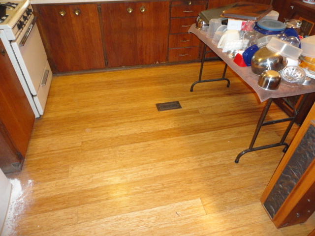 The before shot of the floor and the "kitchen table".