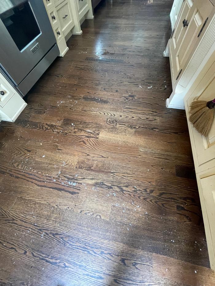 Kitchen floor before. It was after I had cleaned the outside of the oven so lots of baking soda. 