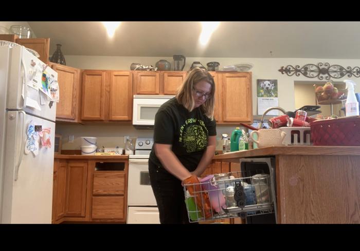 Loading the dishwasher.