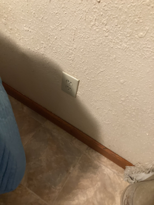 This outlet is near the "foot" of my bed and approximately 12" above the floor.