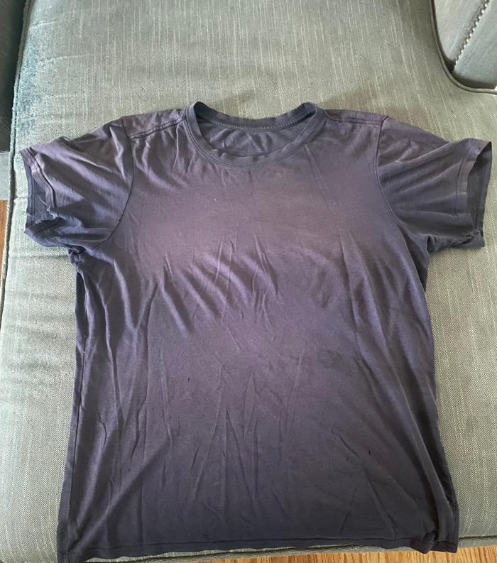 This is an old shirt with lots of little holes and some sun bleaching