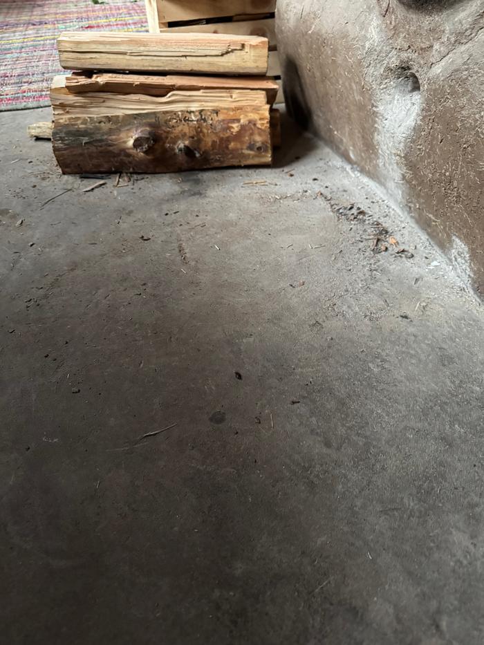 Before, in front of the rocket stove