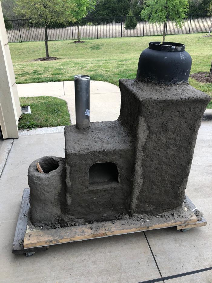 rocket stove made from mud for cooking and electricity generation