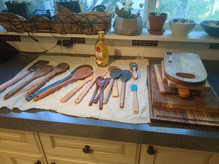 All of the wooden utensils and cutting boards waiting to be oiled.