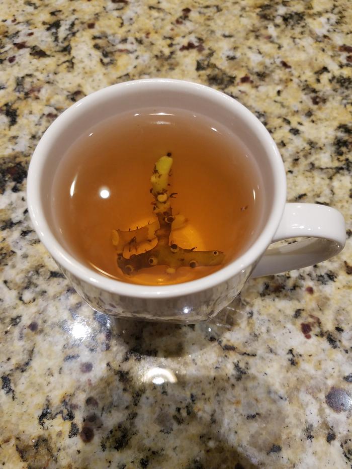 The cup of hot licorice root tea.