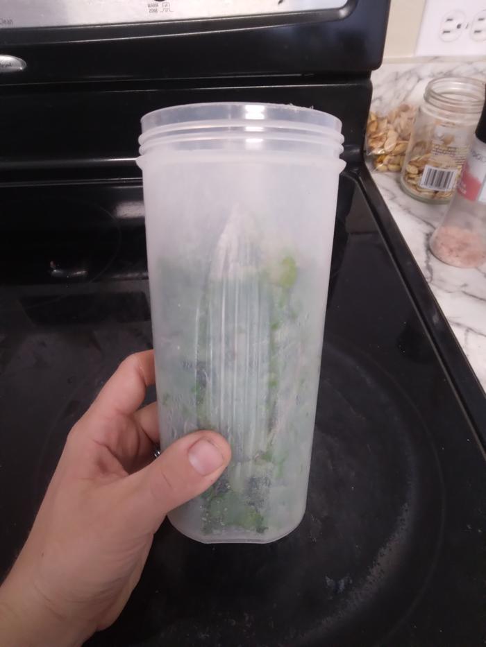 Water bottle with about 3 cups of watercress