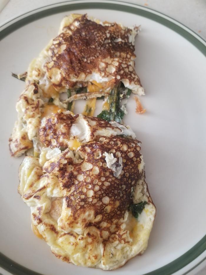 dish 4 completed omlet with dandelions and cheese 