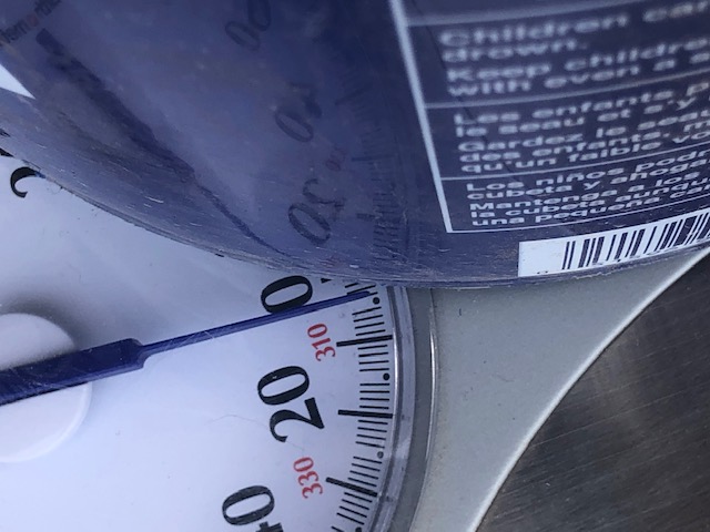 Scale with empty bucket reading 6 lbs (closeup)