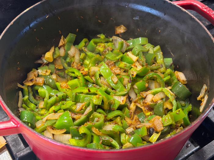 Sweating Anaheims, jalape&ntilde;os, onions and garlic