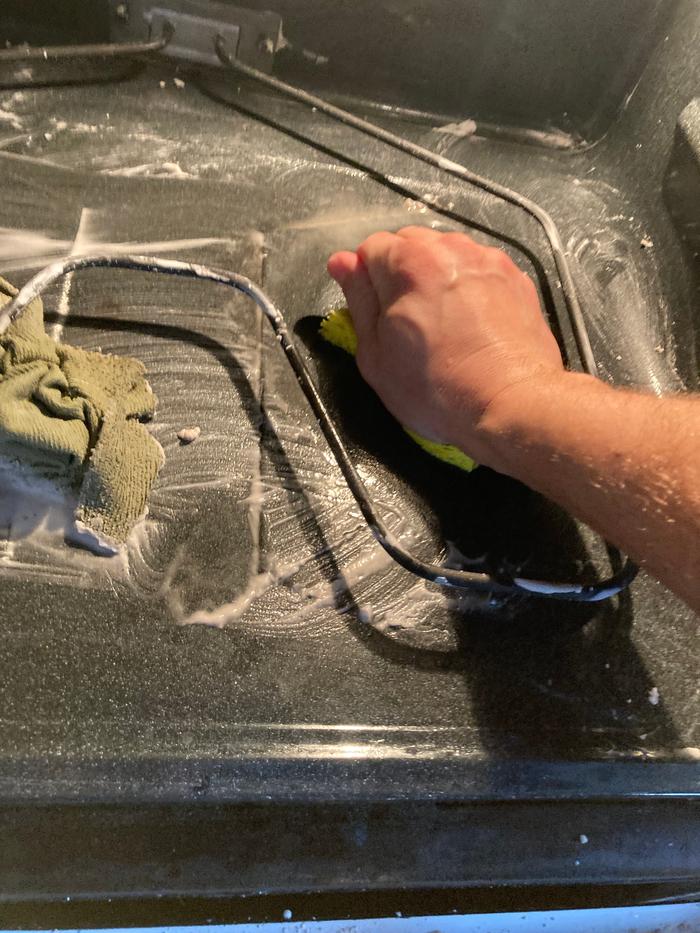 Scrubbing the oven