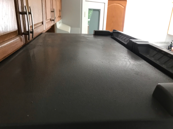 The dusty top of the fridge