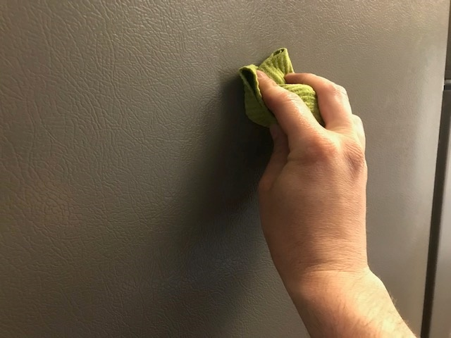 Cleaning the side of the fridge