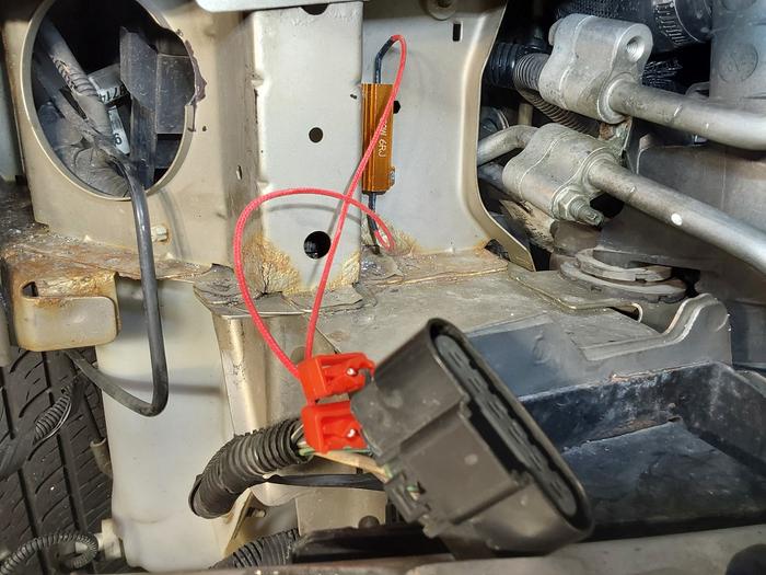 I wired the load resistor to the wiring harness, not the headlight pigtail harness, so I can remove the headlight as needed 