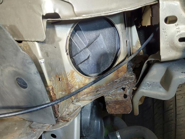 On the driver's side, the hood release cable is hanging around (in the way) 