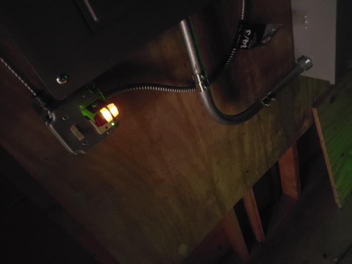 The outlet and the light switch both work