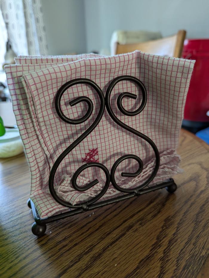 I keep clean napkins in a napkin holder on my table.