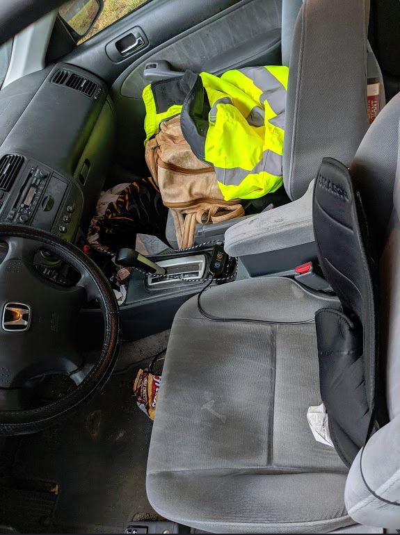 messy front seats of my car