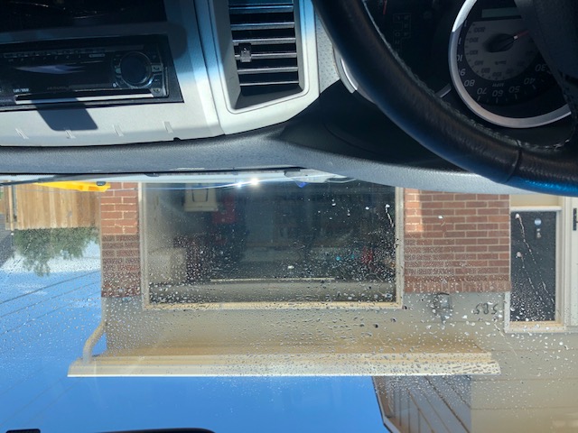 Windshield with cleaner 