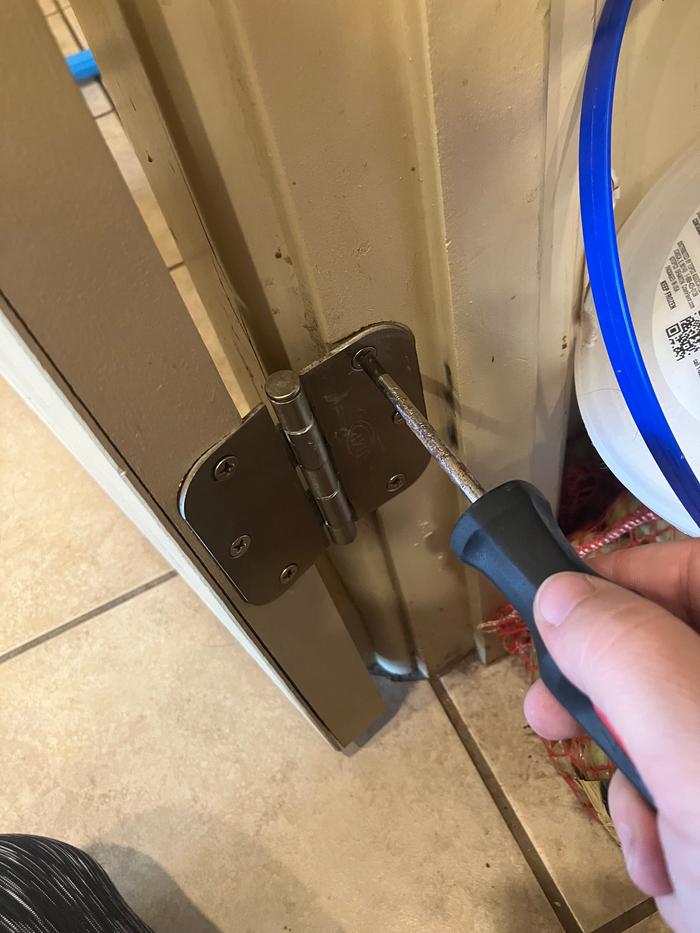 Adjusting the hinges.