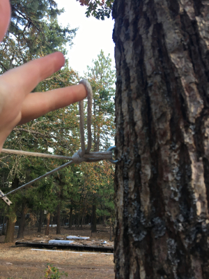 affixing the midpoint of the rope to an eye bolt - then used truckers hitch at the other end