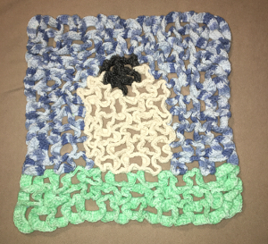 A crochet Sheep Hot Pad - 3-D crochet (about 16 x 16)