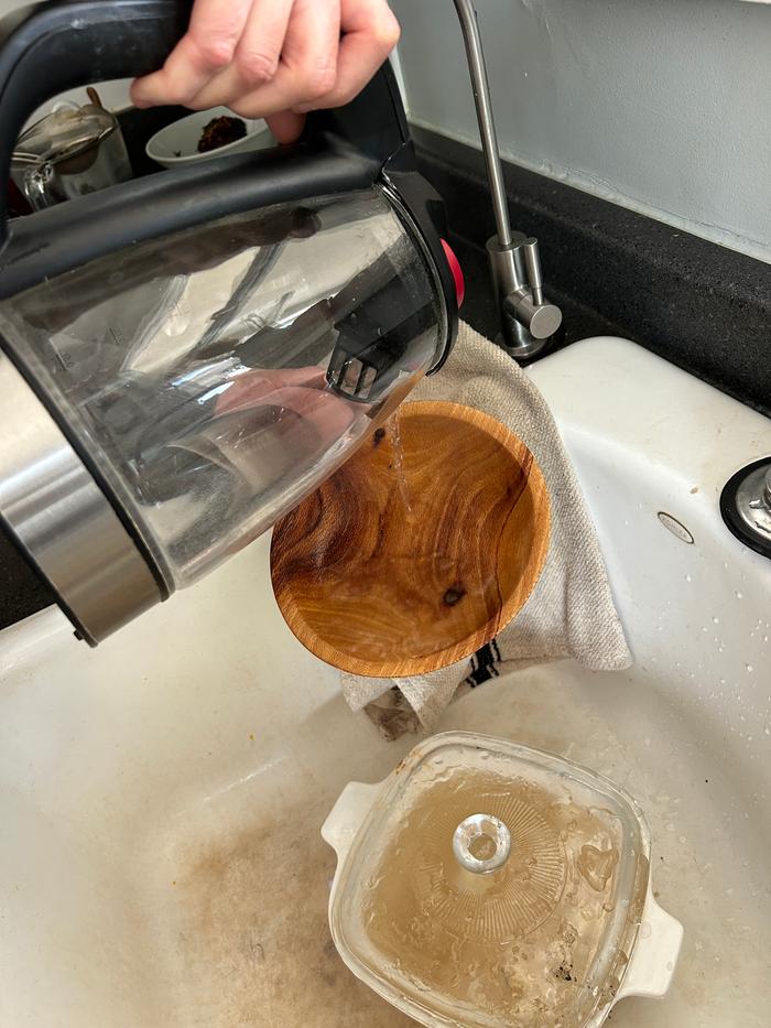 Rinsing off the last bit of grease with leftover hot water from the kettle