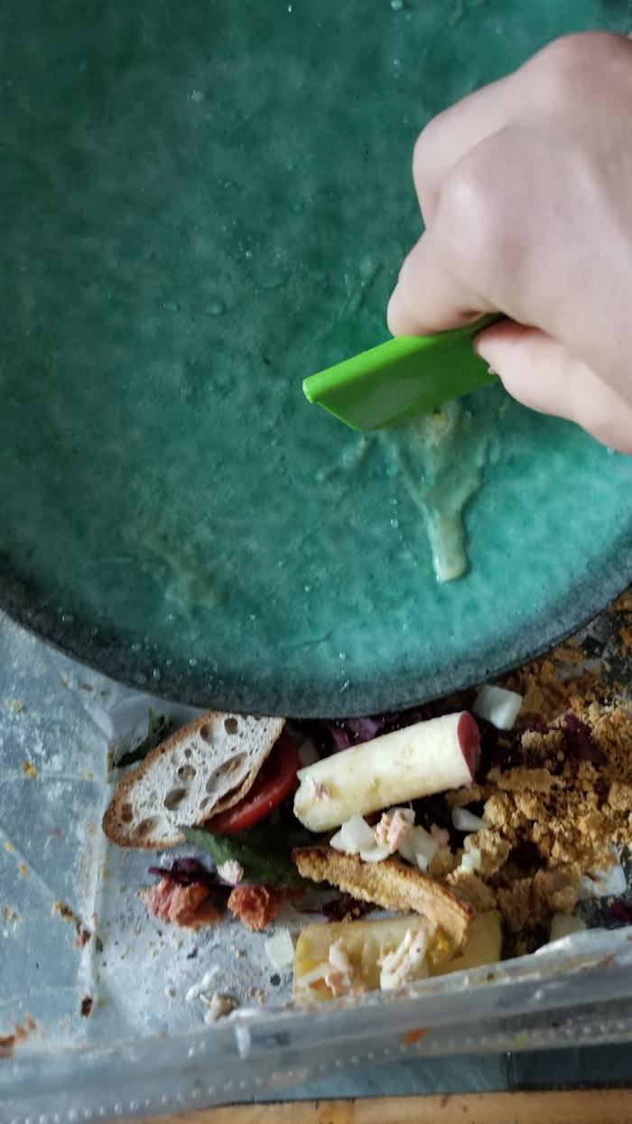 scraping food into compost