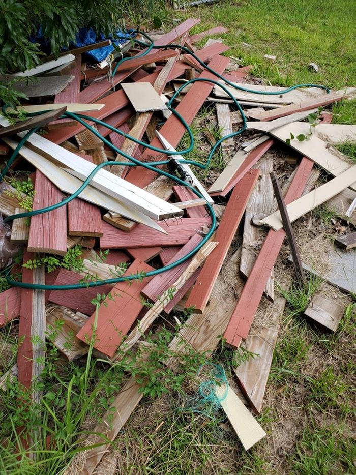 There were lots of piles to clean up, like this one here. A mix of reclaimed materials and also slashed hoses, ruined tarps, and other junk.