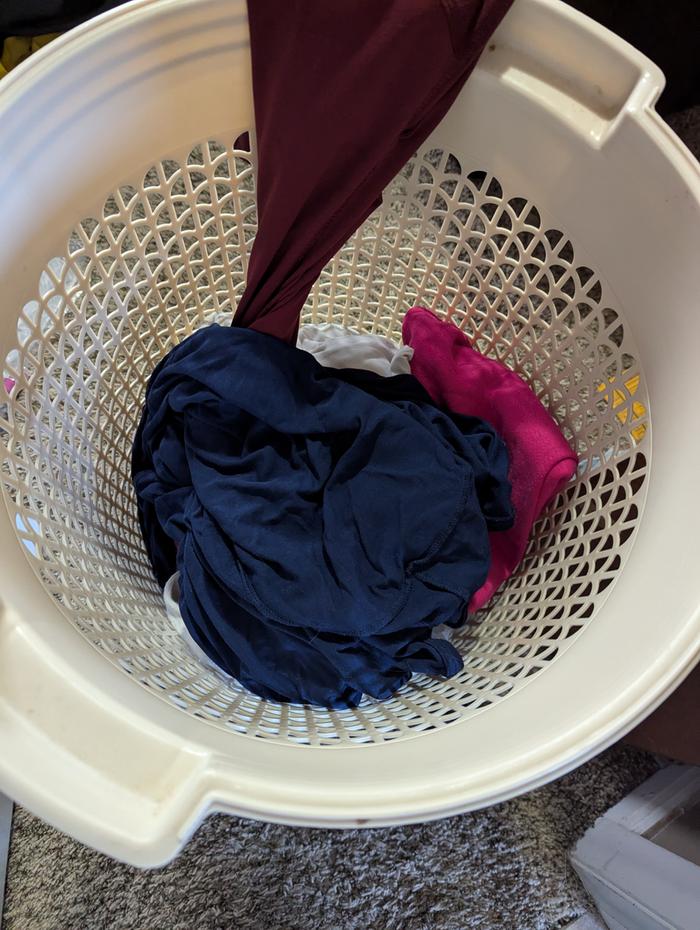 I used to hang dirty rags over the side of the laundry basket until dry.