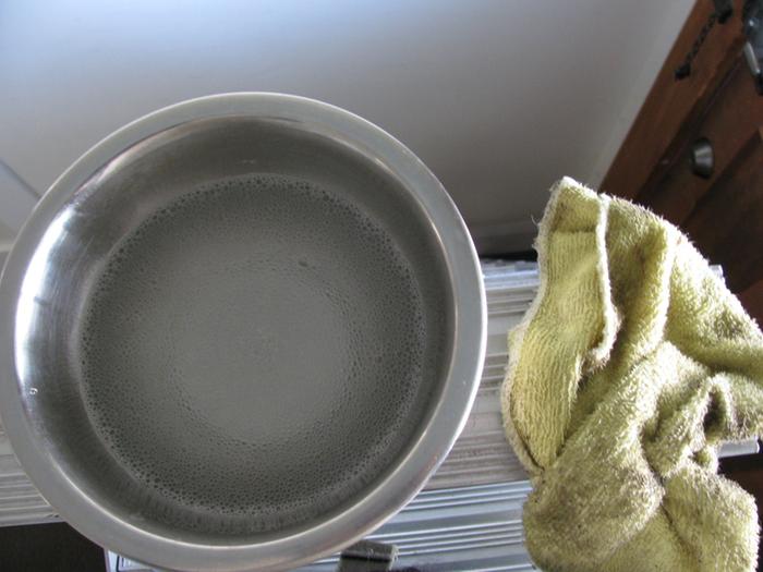 Bowl of vinegary, soapy water for cleaning windows